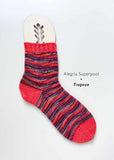 Colorful striped sock on a white background with 'Alegria Superpool Trapeze' branding.