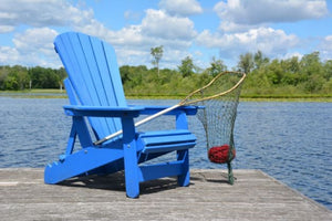 adirondack chair on dock on river holding a net with ball of yarn