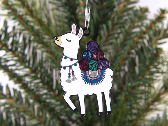 Decorative keychain shaped like a llama with yarn on a Christmas tree.