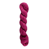 Pink skein of yarn on a white background
